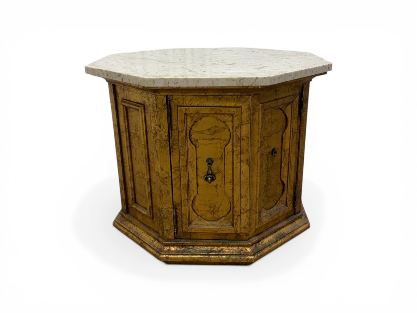 Octagonal Table with Travertine Top: An Octagonal table with a gilt painted cabinet base and travertine top. Dimensions: H: 21.25" W:26" D:26"