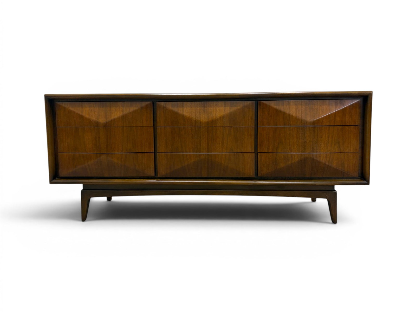 United Diamond Front Mid-Century Triple Dresser: United Furniture mid-century modern triple dresser with 9 drawers. Dimensions: H: 31" W: 74.25" D: 19.25"