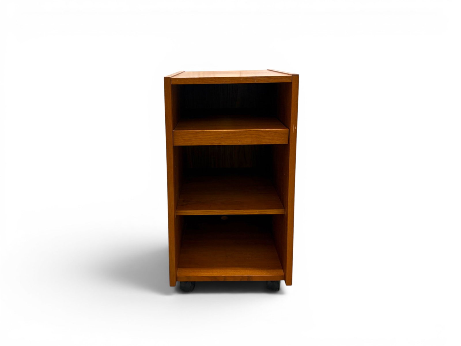 Danish Modern Rolling Cabinet: Danish modern rolling cabinet, with pull-out top shelf. Stamped 'Made in Denmark' on the underside of one shelf. Dimensions: H: 29" W: 15" D: 17"