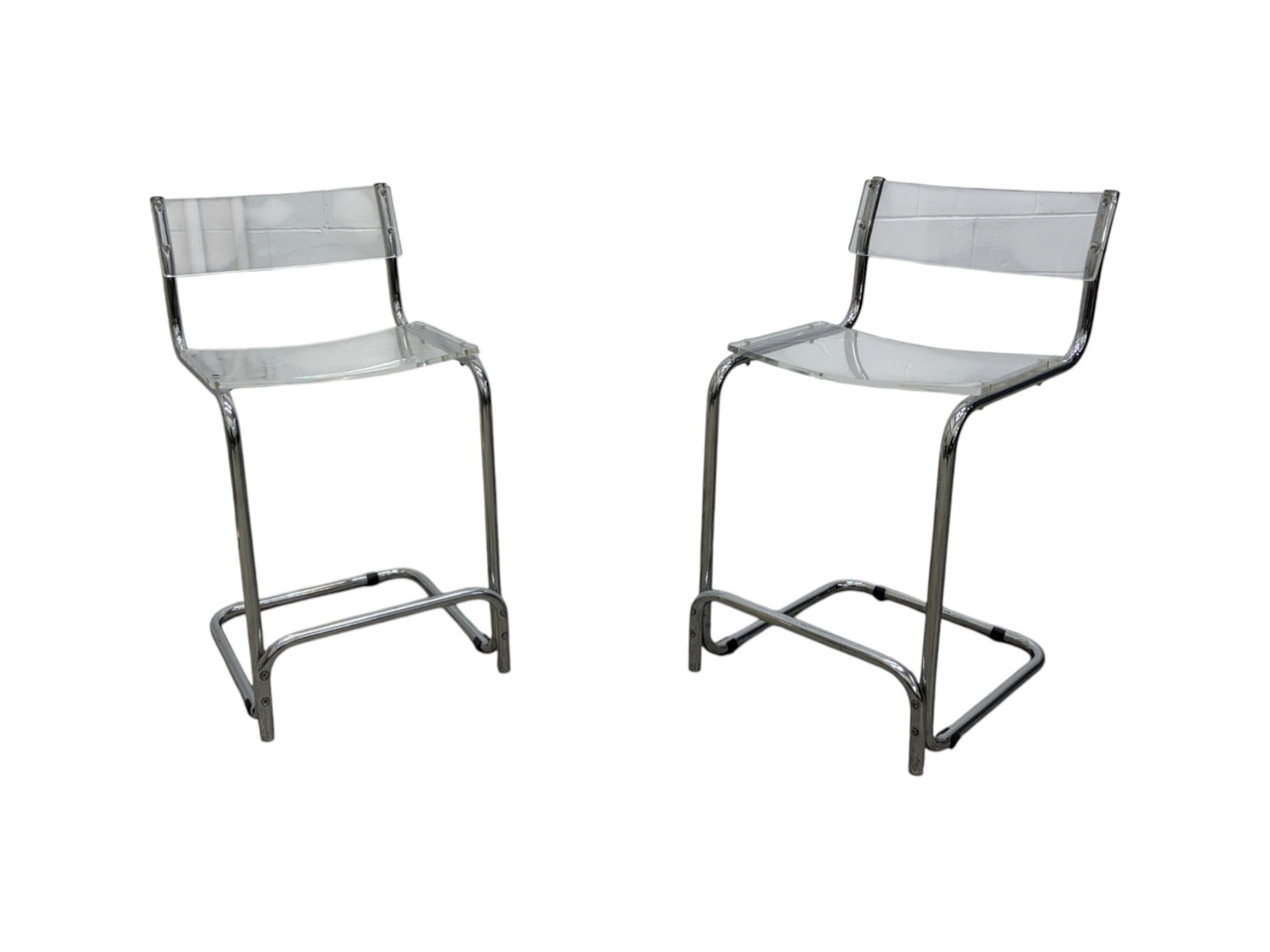 Pair of Marcel Breuer Style Lucite Counter Stools: Pair of Breuer style lucite and chrome counter stools. Dimensions: H:35" W:18.5" D:19.5" Seat Height:24.75"