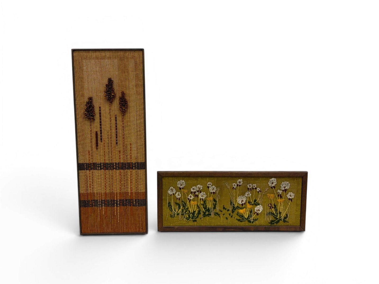 2 Pieces Textile Art: 2 pieces textile art. Handwoven Cattails with yarn, wood and cattails. Needlepoint, flowers. Cattails frame dimensions: H: 36.75" W: 13.75" D: 1.25" Flowers frame dimensions: H: 12.75" W: 30.5" D: 1"