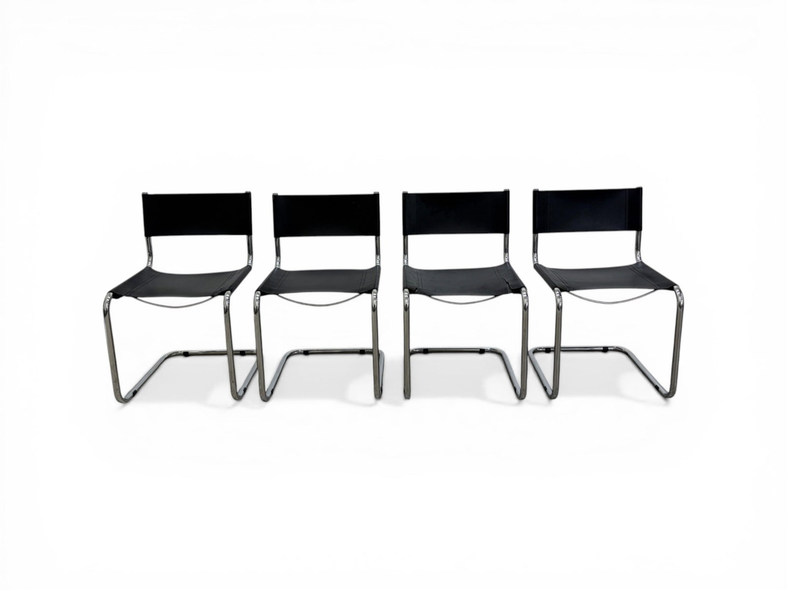 4 Marcel Breuer Style Cantilever Chairs: Set of 4 Marcel Breuer style cantilever chairs. Stamped 2-98 on the undersides of the seats, otherwise unsigned. Dimensions: H: 37" W: 19" D: 21" Seat Height: 19"