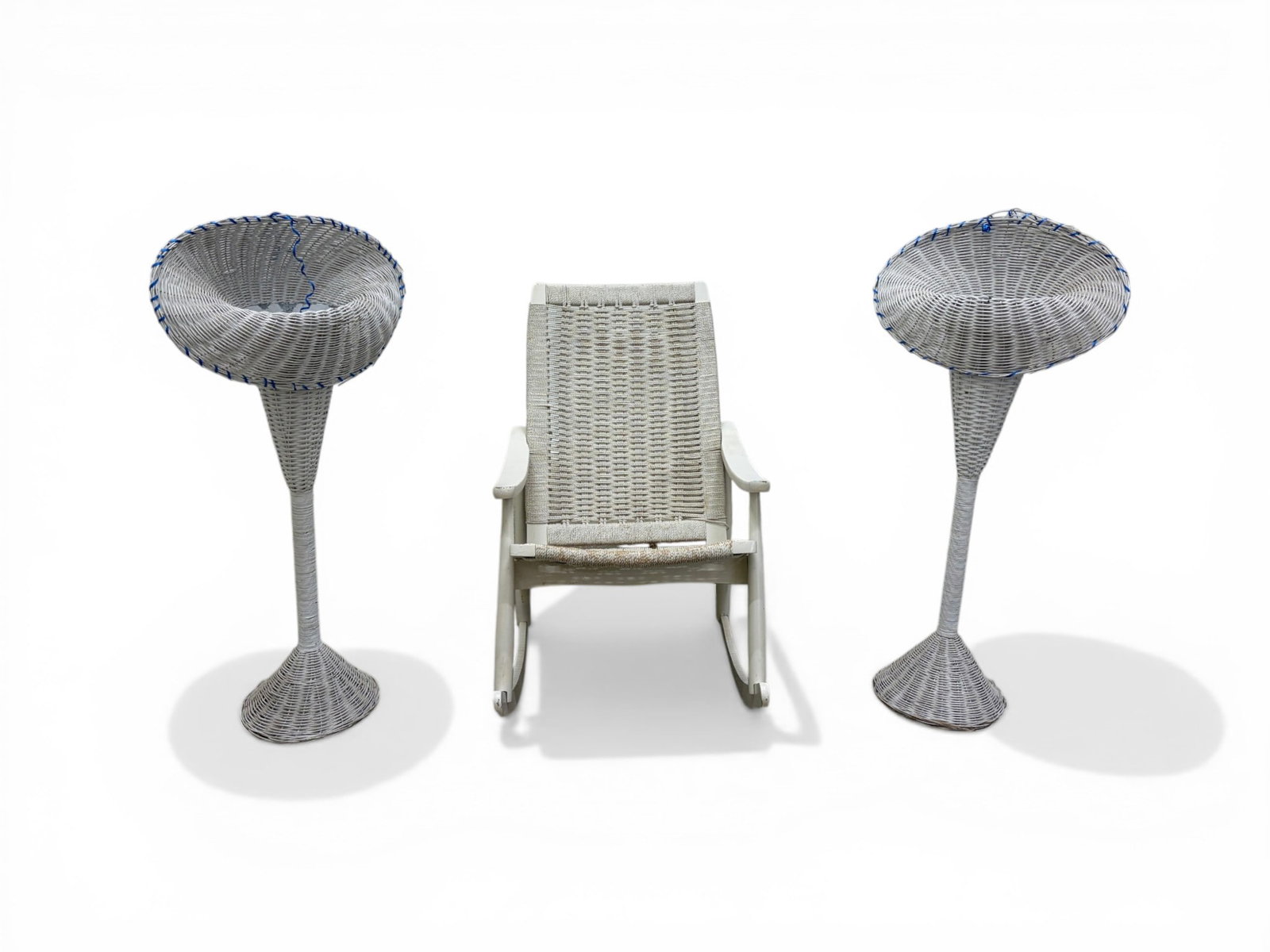 Wegner Style Rocking Chair & 2 Wicker Planters: Hans Wegner style rocking chair. White painted wood with woven rope seat and back with a pair of wicker trumpet form planters. Chair dimensions: H: 36.5" W: 24.5" D: 40", seat height 20" Planter