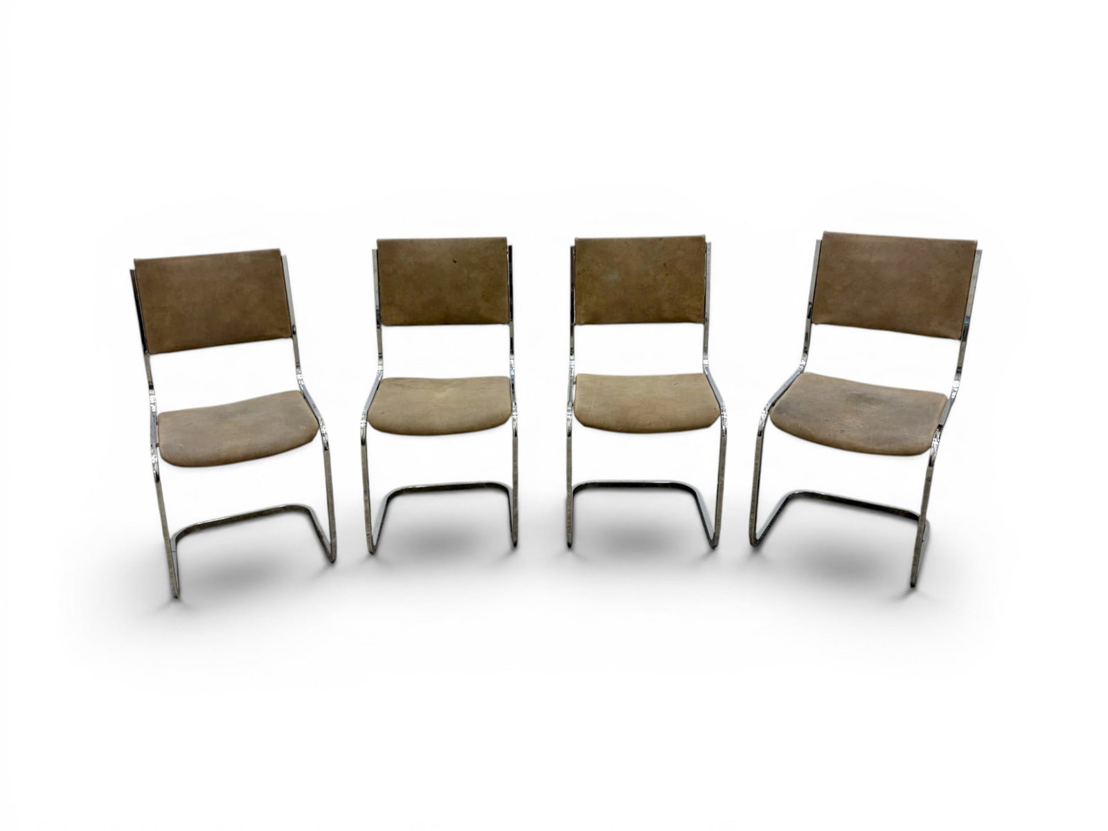 4 Modern Chrome & Suede Dining Chairs: Set of 4 modern chrome dining chairs with suede upholstery. Unmarked. Dimensions: H: 33.25" W: 17.5" D: 21.5", seat height 17"