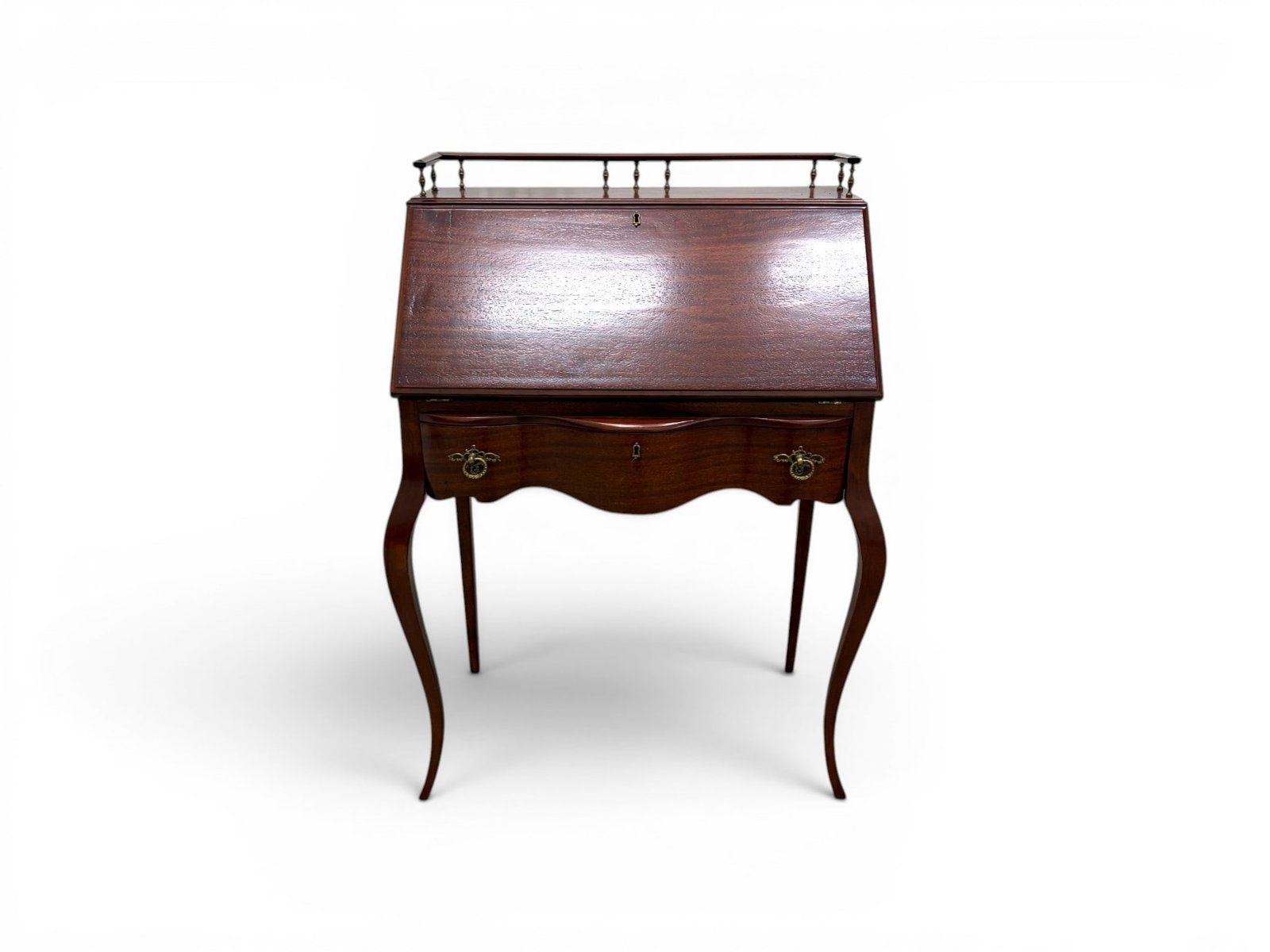 Mahogany Ladies Writing Desk: Mahogany ladies writing desk. Drop front with interior drawer and compartments, one drawer below. Dimensions: H: 40" W: 27.75" D: 16.5"