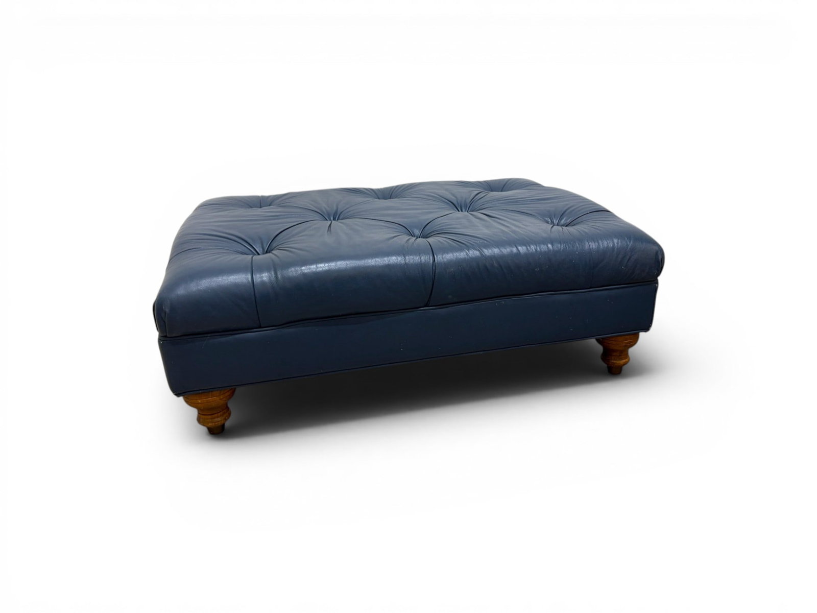 Blue Tufted Leather Ottoman: Blue tufted leather ottoman. Dimensions: H: 14.25" W: 40" D: 30"