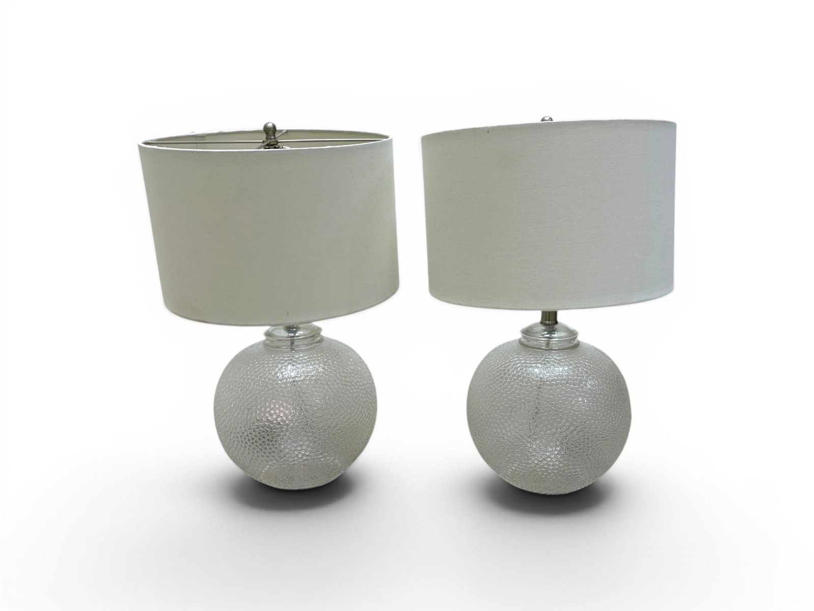 Pair Textured Glass Table Lamps: Pair of modern textured glass table lamps. Dimensions to tops of finials, not including shades: H: 22" W: 9.5" D: 9.5"