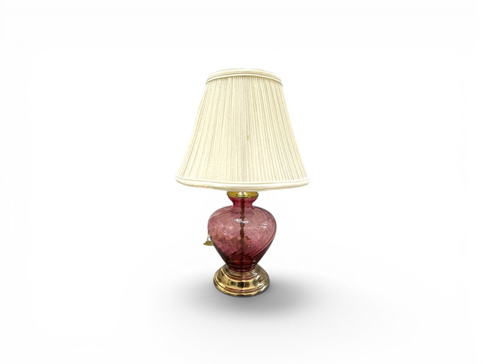 Cranberry Glass & Brass Table Lamp: Cranberry glass and brass table lamp. Dimensions without shade to top of finial: H: 20" W: 6.25" D: 6.25"