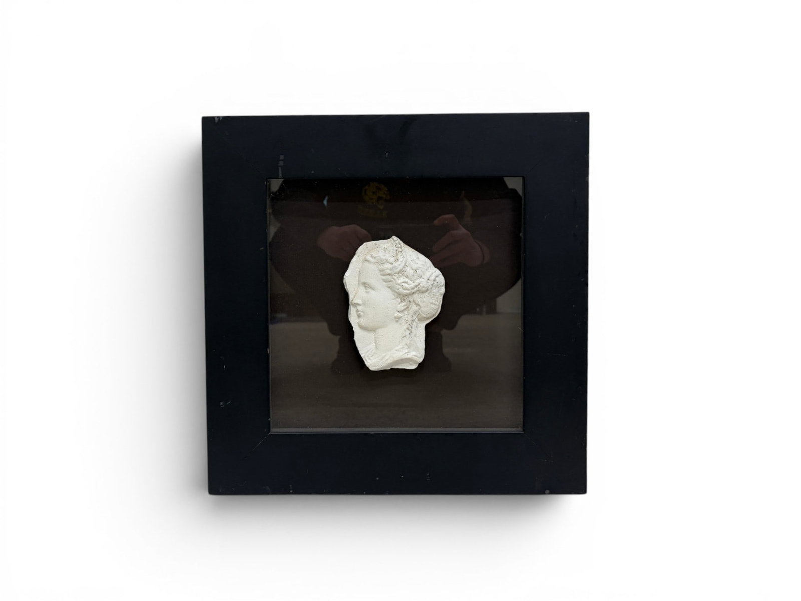 Framed Plaster Relief Head: Framed plaster relief sculpture of a head. Unsigned. Dimensions with frame: H: 15" W: 15" D: .75"