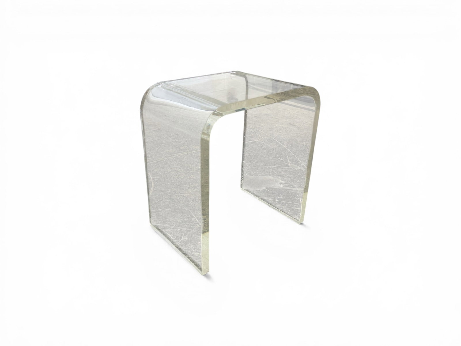 Lucite Stool: Lucite stool or end table. Dimensions: H:17.75" W:16.25" D:11"