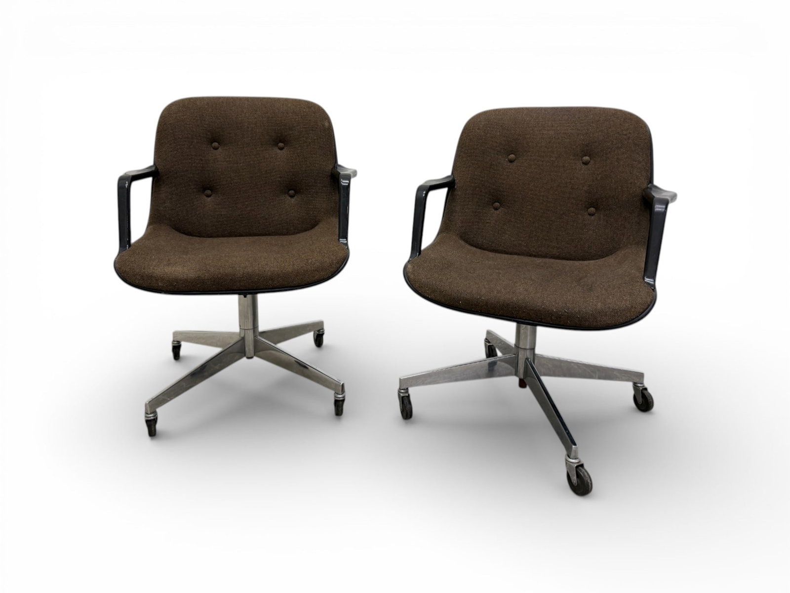 Pair of Mid-Century Rolling Armchairs by United: A pair of Mid-Century Rolling Armchairs by United Chair Co. The executive chairs are on casters for easy movement. Dimensions:H:35" W:26.5" D:23" Seat Height:17"