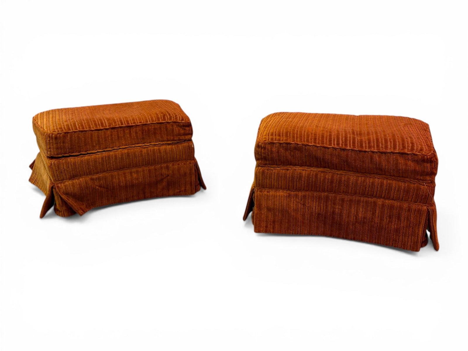 Pair of Curved Ottomans: Pair of curved ottomans, with orange brown upholstery. On casters. Dimensions: H:15" W:29.5" D: 21"