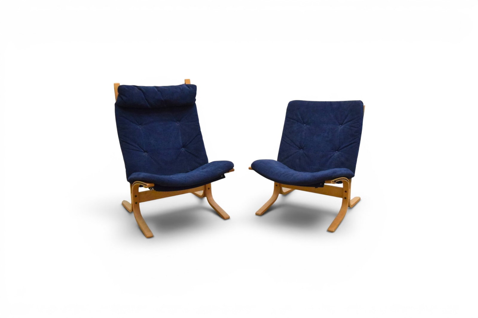 Pair Westnofa Siesta Chairs: Pair of Westnofa Siesta lounge chairs with blue suede upholstery. Taller chair with head rest. Westnofa Furniture Made in Norway labels on the undersides. Taller chair dimensions: H: 38.75" W: 25.5"