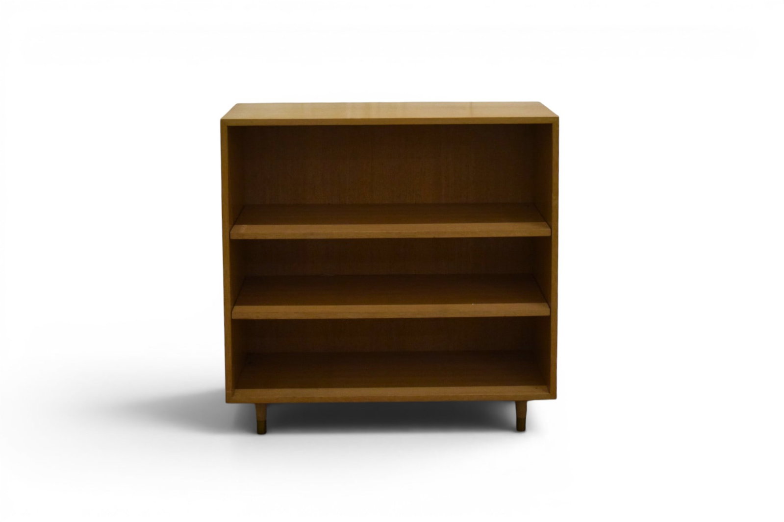 Barzilay Modern Blonde Bookcase: Barzilay mid-century modern blonde bookcase, with brass feet. Unmarked. Dimensions: H: 36.25" W: 36" D: 12.5"
