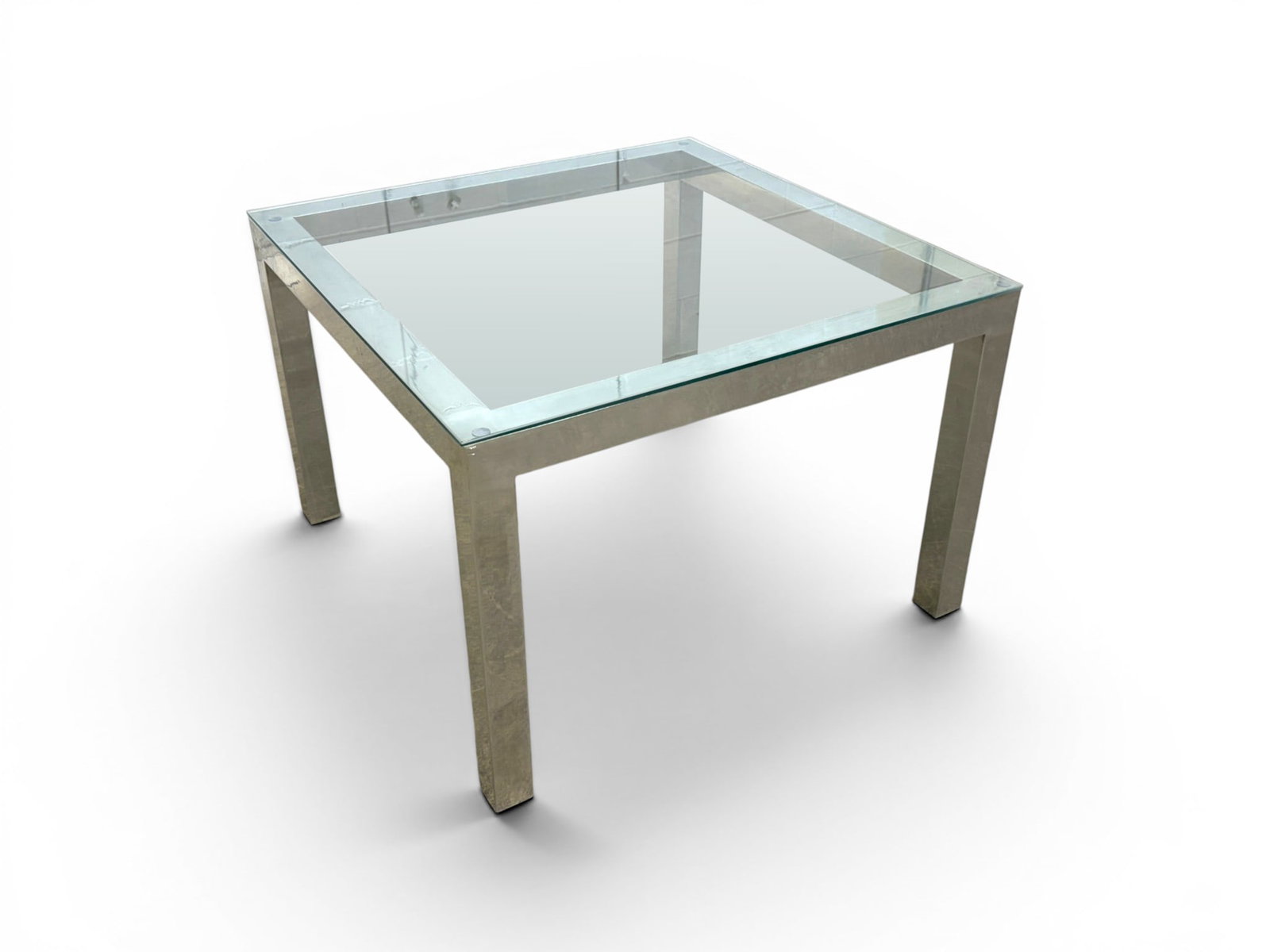 Chrome & Glass Side Table: Chrome and glass side table. Unmarked. Dimensions: H: 20.5" W: 30" D: 30"
