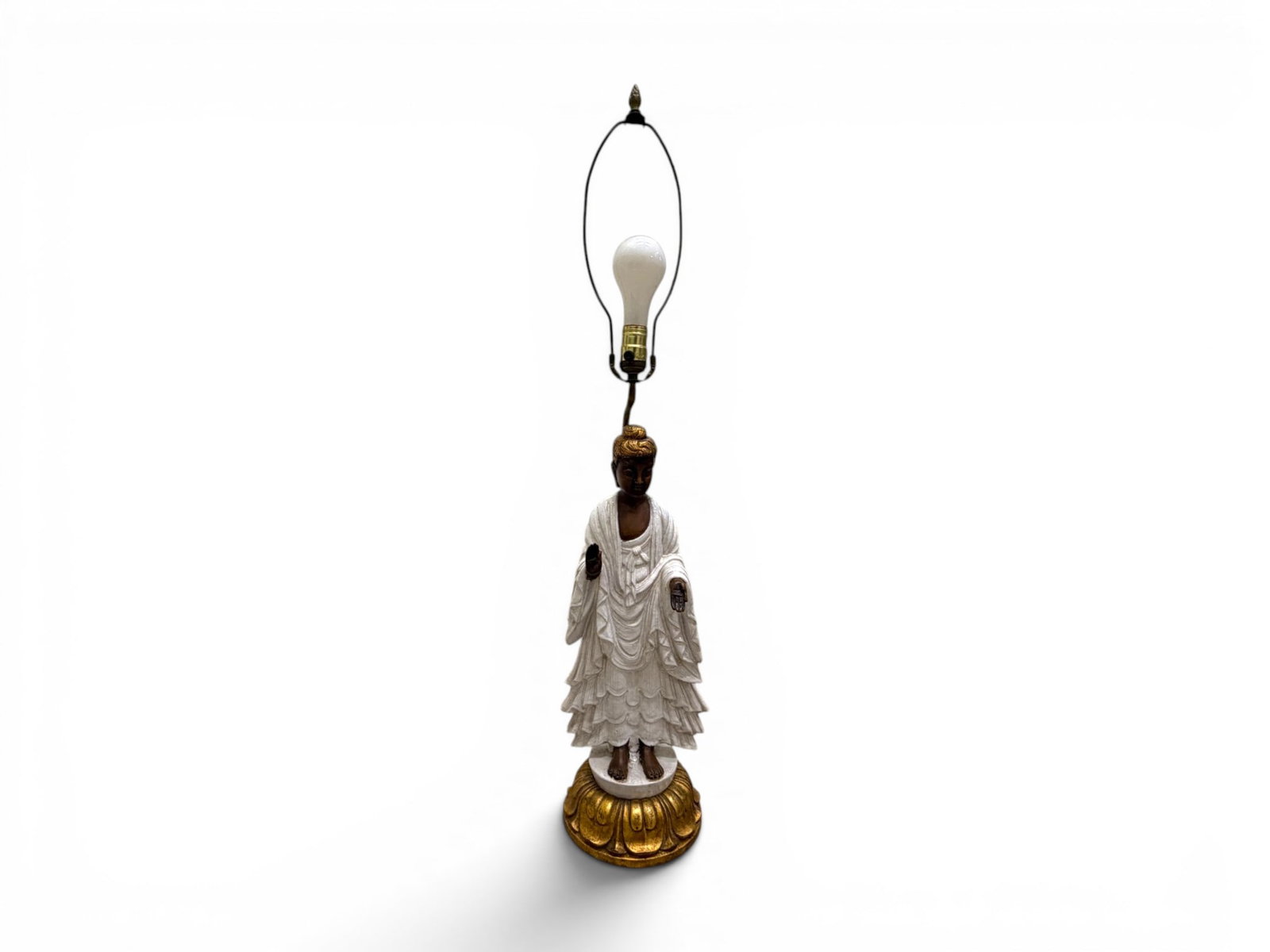 Standing Buddha Pottery Table Lamp: Figural standing Buddha pottery table lamp on gilt metal base. Dimensions to top of finial: H: 36.5" W: 7.5" D: 7.5"
