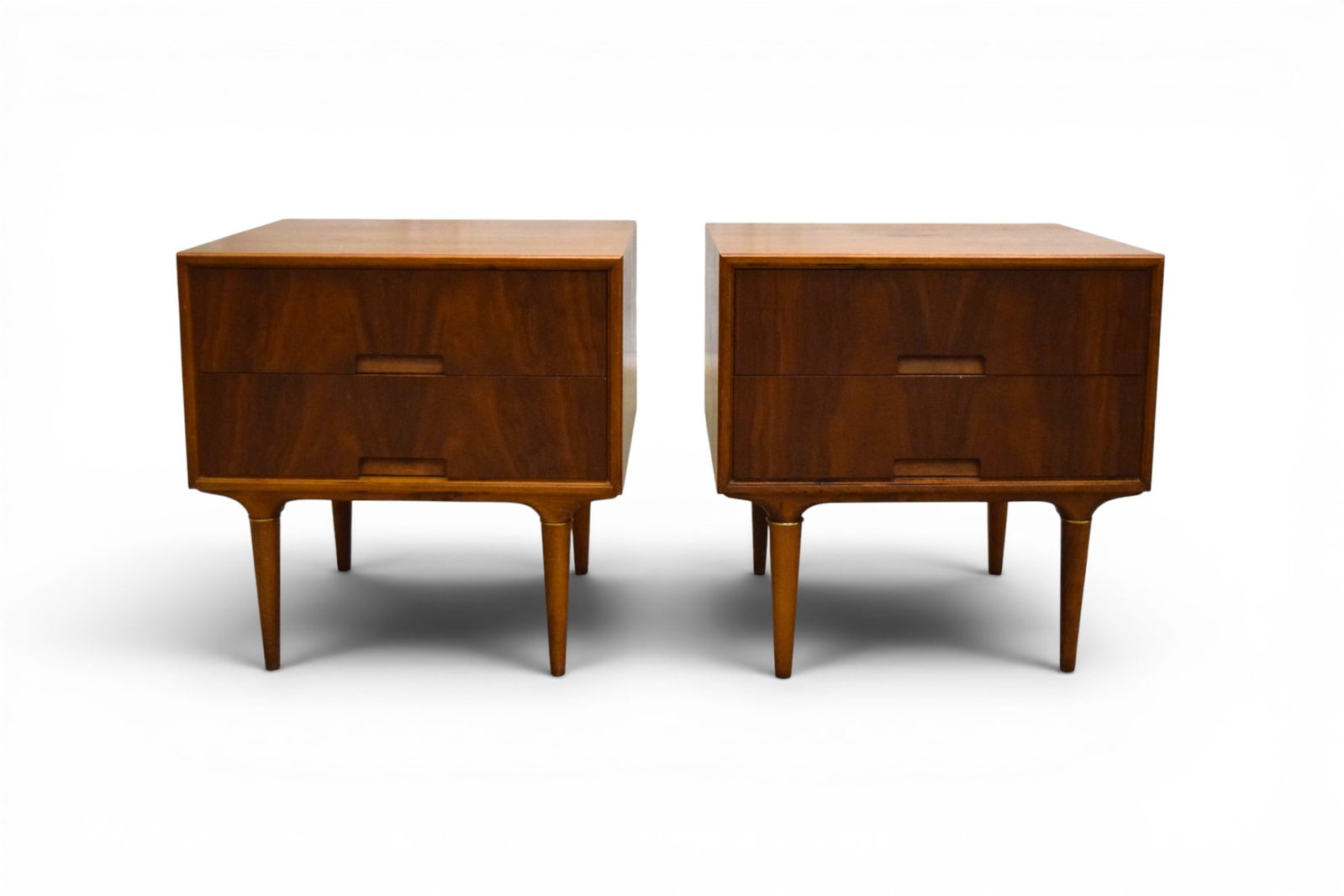 Pair Svante Skogh for Seffle Nightstands: Svante Skogh for Seffle, pair of Swedish modern nightstands. 2 drawers, with brass accents on legs. Marked Seffle and Made in Sweden on back panels. Dimensions: H: 22.375" W: 22.125" D: 19.125"