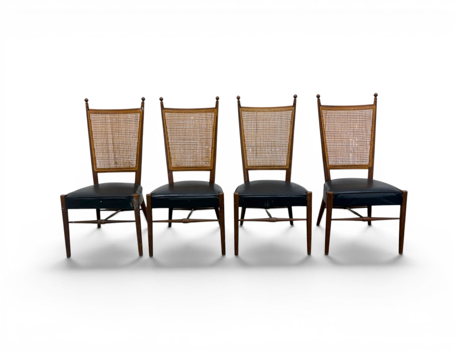 4 Drexel Leather & Cane Dining Chairs: Set of 4 Drexel dining chairs. Walnut, with leather seats and cane backs. Unmarked. Dimensions: H: 39" W: 19.5" D: 21", seat height 16.5"