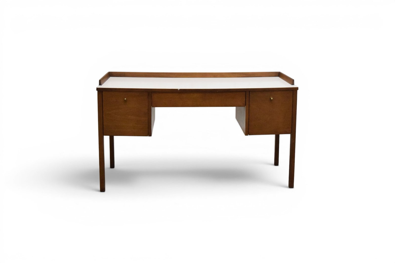 Mid-Century Modern Desk With Laminate Top: Mid-century modern desk, with brass pulls and white laminate top. Dimensions: H: 30" W: 51.75" D: 18"