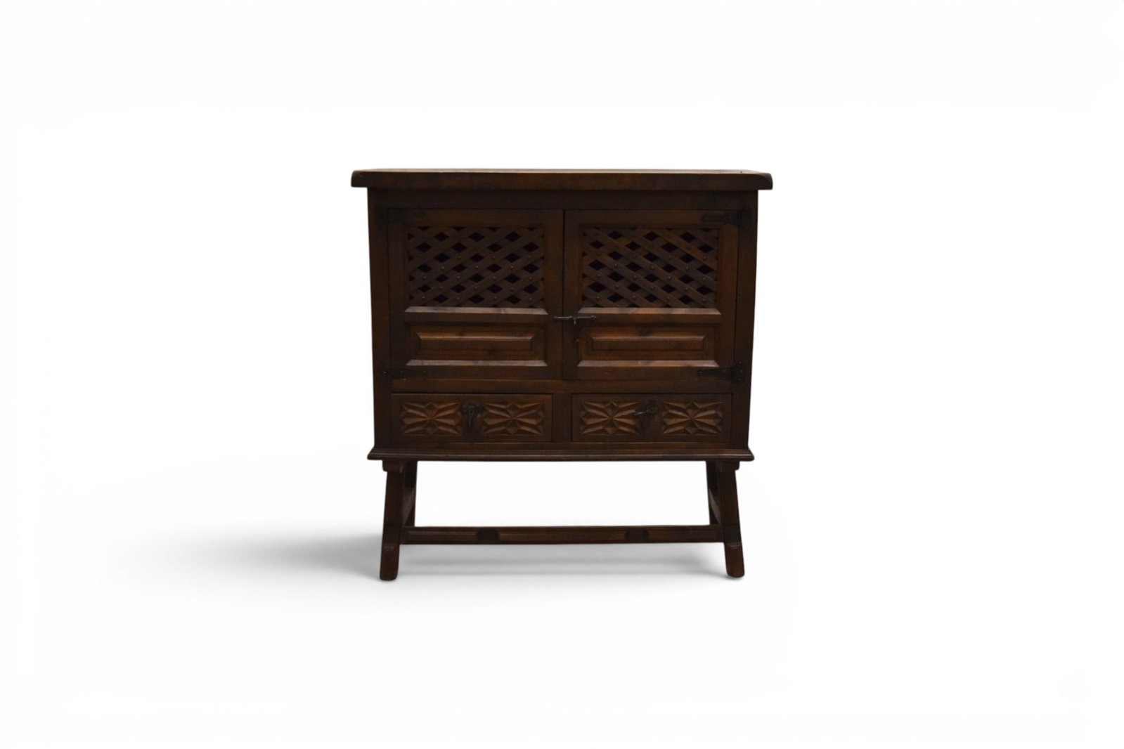 Spanish Style Cabinet: Carved Spanish style cabinet. 2 doors and 2 drawers below. Dimensions: H: 39.5" W: 37.75" D: 15"