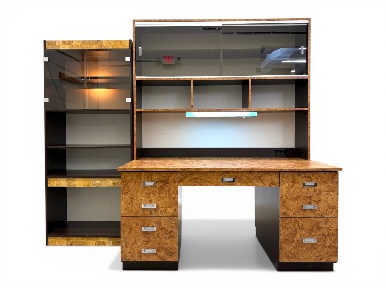 Burl Laminate Veneer Desk & Cabinet: Custom built desk and cabinet. Burlwood laminate veneer desk and cabinet. Desk with 8 drawers, chrome pulls. Hutch top with shelves and sliding glass doors, lighting and 2 outlets. With a burlwood