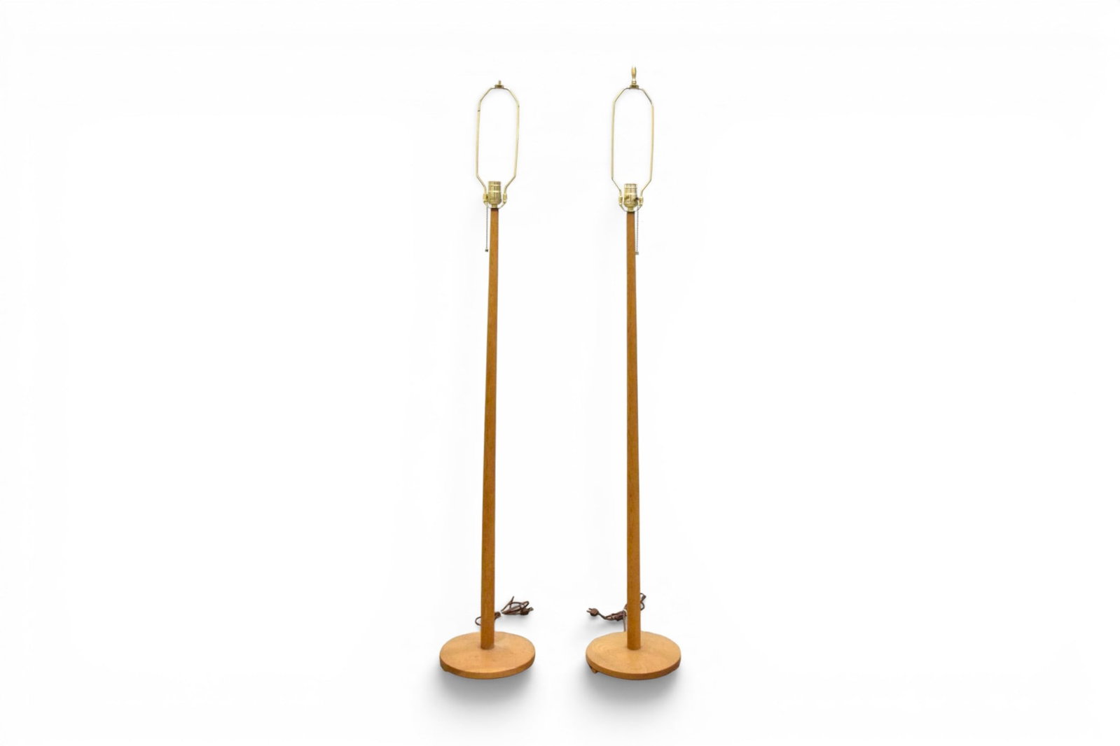 Pair Attr. to George Kovacs Teak Floor Lamps: Attributed to George Kovacs, pair of Scandinavian mid-century modern teak floor lamps. Marked SI 621 and with Made in Sweden label on the undersides. Dimensions to top of finials: H: 59.75" W: 10" D: 