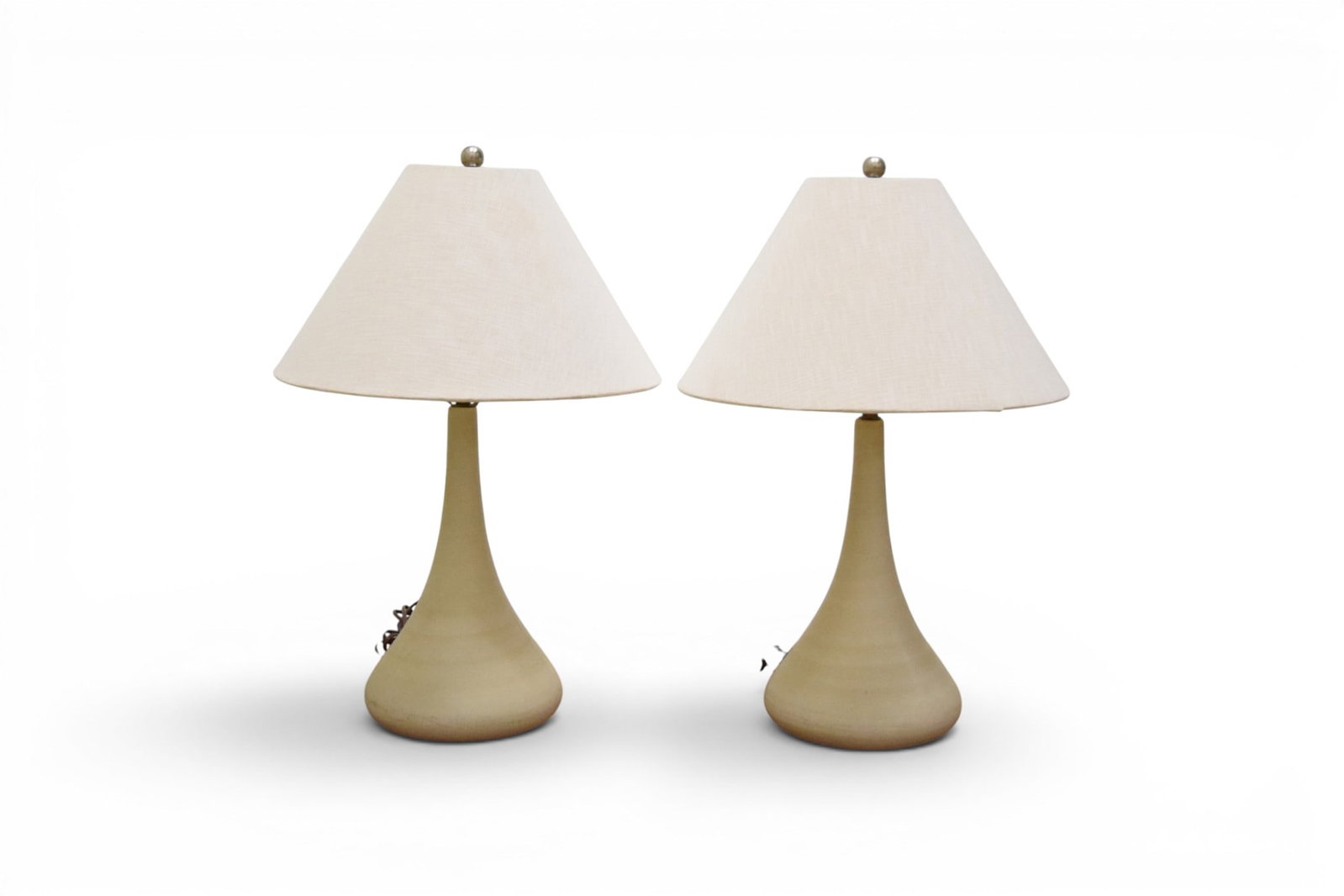 Pair George Scatchard Pottery Table Lamps: George Scatchard, pair of pottery genie or tulip form table lamps. Signed G. Scatchard and dated 1995 on the undersides. Dimensions: H: 24.25" W: 8.25" D: 8.25"