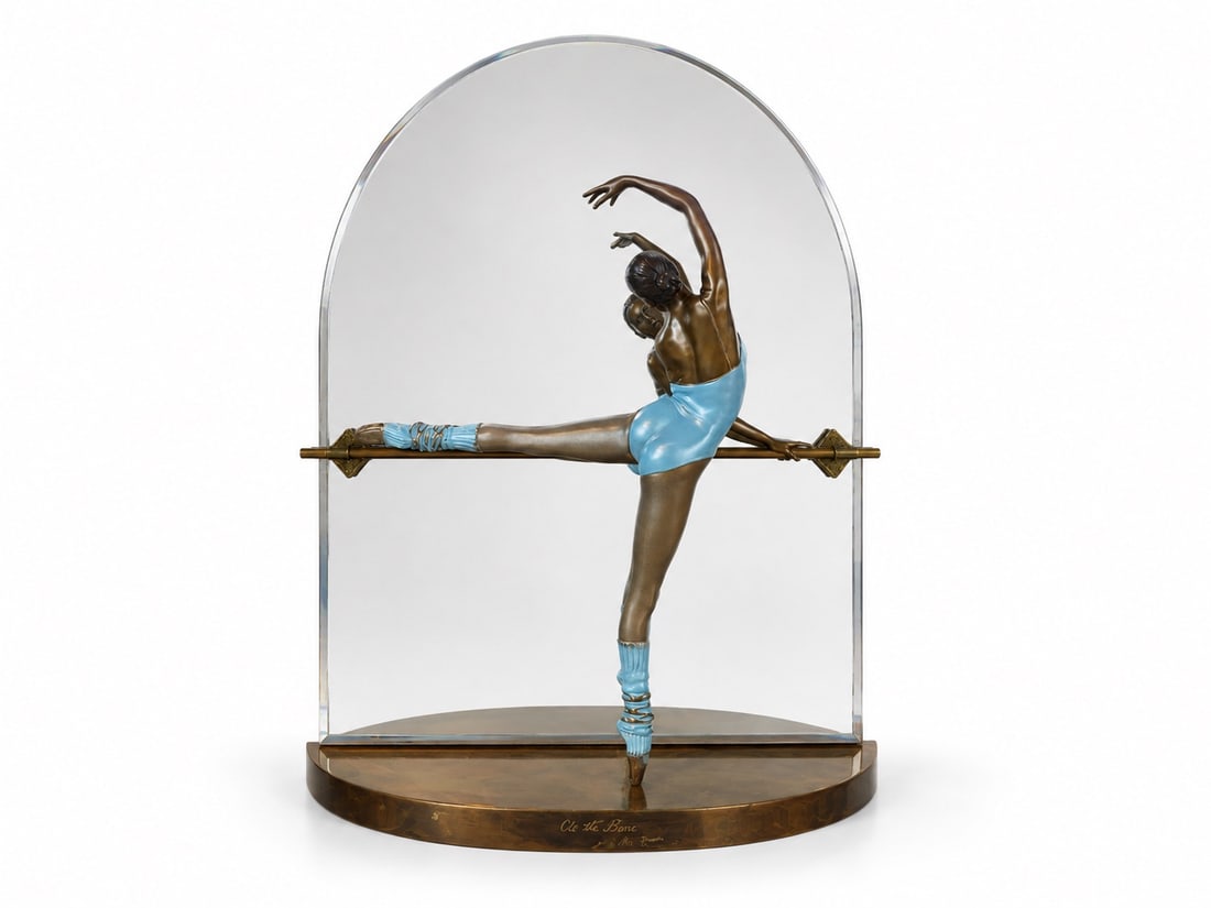 Ramon Parmenter At The Barre Bronze Sculpture: A Signed Bronze Wall Sculpture titled 'At The Barre' by Ramon Parmenter. Ballerina Leg & Brass Ledge Signed & Dated 1987 33/74. Dimensions: H:33.5" W:27" D:9"