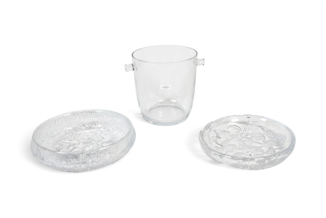 3 Piece Glass Lot Including Jonasson, Wirkkala: Mats Jonasson for Royal Krona "musicians" bowl, signed along the rim; Tapio Wirkkala for Iitala, "Lunaria" bowl; Essentials Optique glass ice bucket with original box. Jonasson bowl dimensions: H: