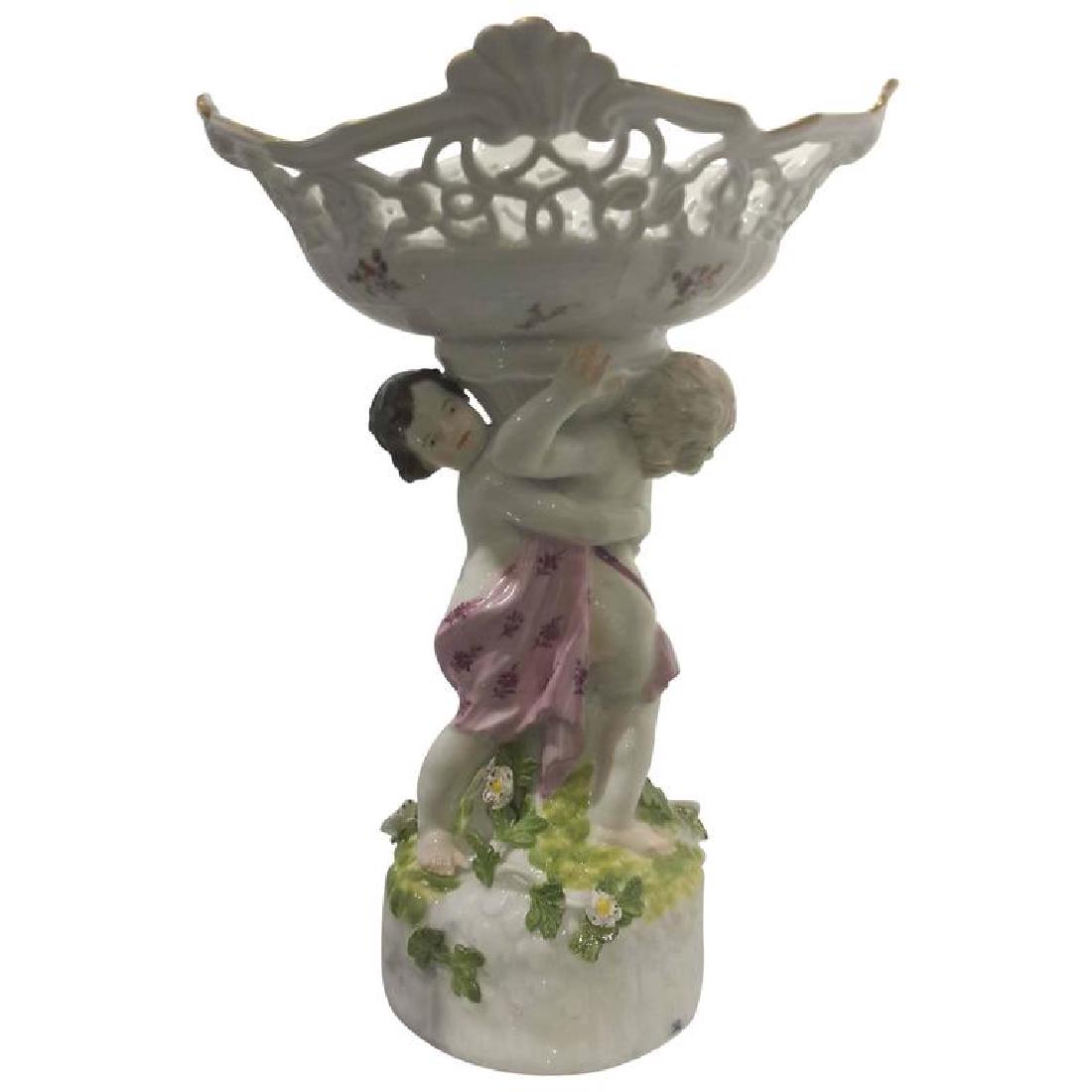 Meissen Porcelain Figural Centerpiece, circa 1780: Meissen Porcelain figural centerpiece, circa 1780. Underglazed blue crossed swords mark. DIMENSIONS 9.75 in.Hx6.75 in.Wx3.50 in.D