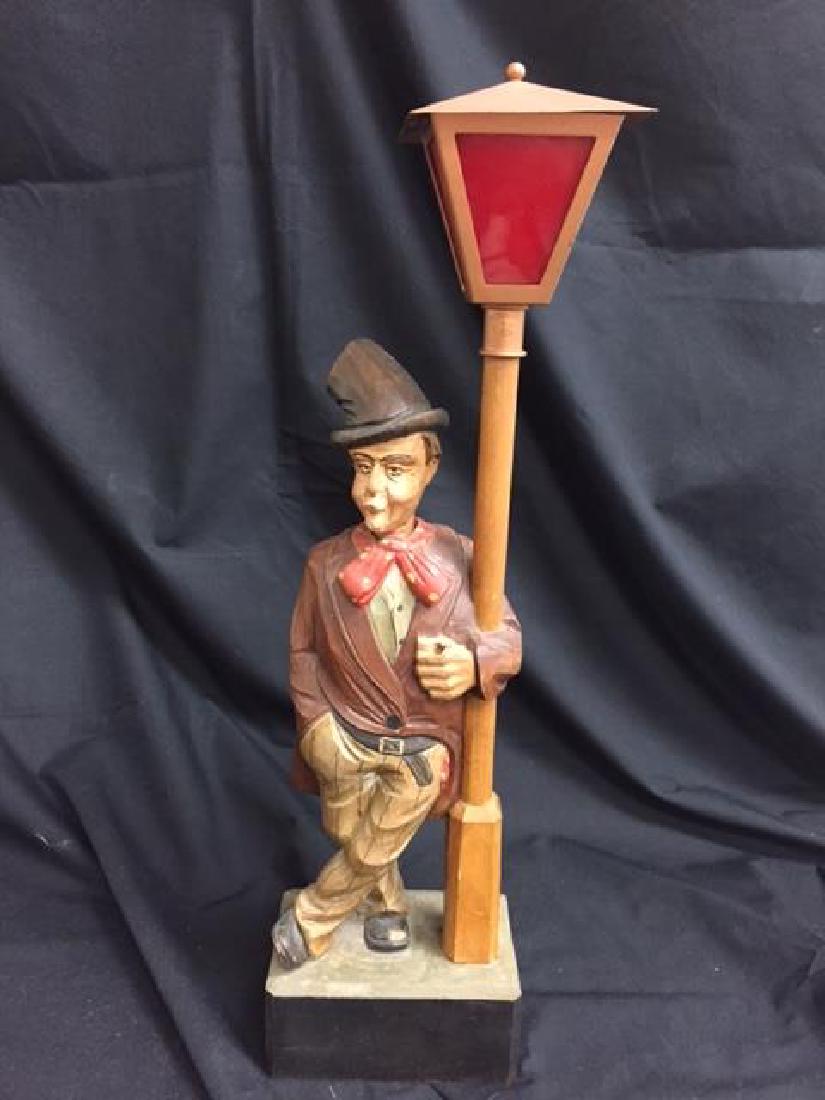 The Whistling Man By Karl Griesbaum, West Germany, C: By Karl Griesbaum, West Germany, C 30's. Wooden carved man with his arm around the lampost. Currently not working. The contacts need cleaning, and the mechanics need to be looked at. It appears that a