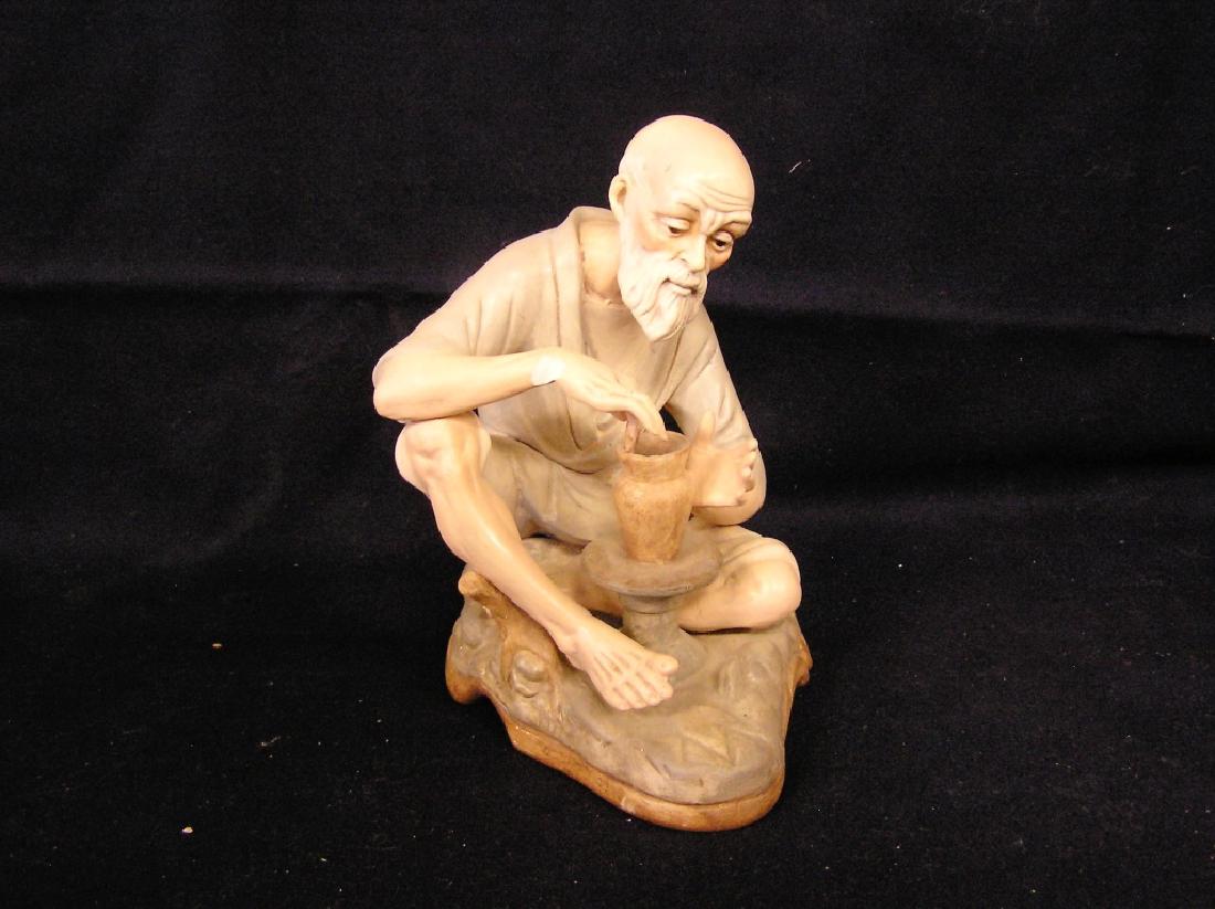 Man Making a Bowl Narco Pottery - Chip on right arm: Narco Pottery - Chip on right arm