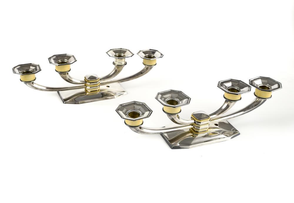 MARCEL WOLFERS (1886-1976) FOR WOLFERS FRÈRES: Marcel Wolfers (1886-1976) for Wolfers FrèresPair of candlesticks800 silver and ivory. Silversmith's hallmark on each piece.Drilled for electric wiring. Missing one ivory ring. H : 10 cm Width :