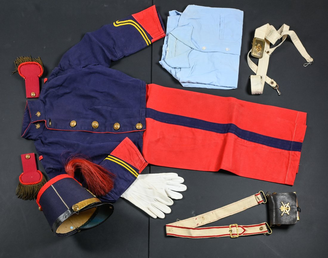 Child's set - Belgian artilleryman's uniform: Child's set - Belgian artilleryman's uniformCA. 1950-1960Shako with crossed canon motif, red willow tassel; short blue canvas vest, red trimmings and piping; blue shirt; red pants with blue bands, pai