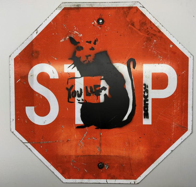 Banksy Spray paint over original stop sign (1 of 5)