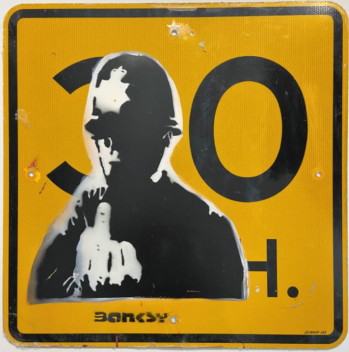 Banksy Spray paint over original sign: Private Collection. Banksy is an anonymous England-based graffiti artist, political activist and film director of unverified identity. Their satirical street art and subversive epigrams combine dark h