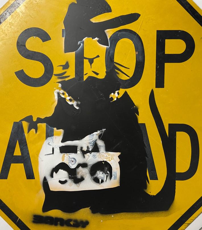 Banksy Spray paint over original sign: Private Collection. Banksy is an anonymous England-based graffiti artist, political activist and film director of unverified identity. Their satirical street art and subversive epigrams combine dark h