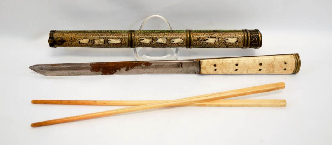 Chinese Bone Knife and Chop Sticks Set: A Chinese bone knife and chop sticks set in case. Measures 12.75" when all encased. We ship most items in house. Exclusions include furniture, oversized framed artwork and heavier items. Please inquir