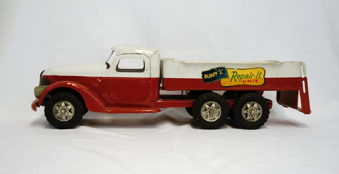Vintage Buddy L Repair-It Unit: A vintage Buddy L Repair-It Unit pressed steel truck. Measures 22". We ship most items in house. Exclusions include furniture, oversized framed artwork and heavier items. Please inquire for shipping q