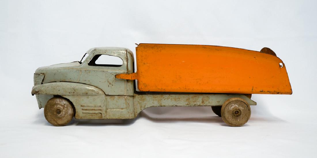 Buddy L Pressed Steel Dump Truck: Buddy L pressed steel dump truck. Measures 16.75" in length. We ship most items in house. Exclusions include furniture, oversized framed artwork and heavier items. Please inquire for shipping quotes.