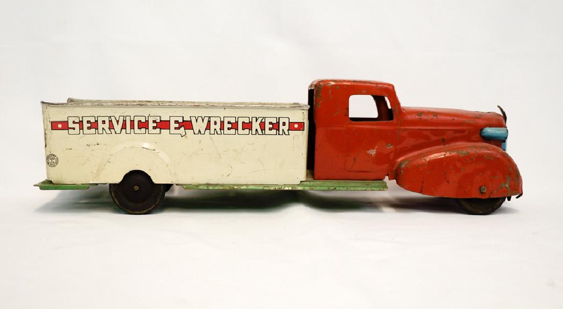 Vintage Wyandotte Service Wrecker Pressed Steel: A vintage Wyandotte pressed steel Service Wrecker. Measures 17.5". We ship most items in house. Exclusions include furniture, oversized framed artwork and heavier items. Please inquire for shipping qu