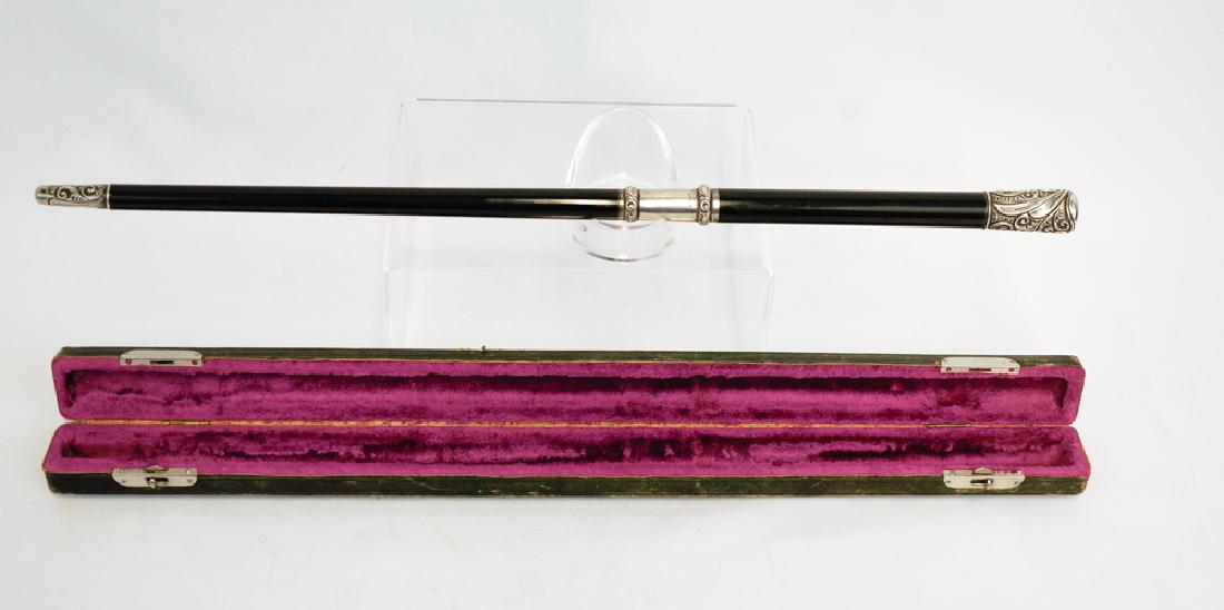 Fine Sterling Ebony Music Conductors Baton in Case: A fine sterling mounted conductors baton in fitted case. Measures slightly over 16" (41 cm). Excellent condition. We ship most items in house. Exclusions include furniture, oversized framed artwork an