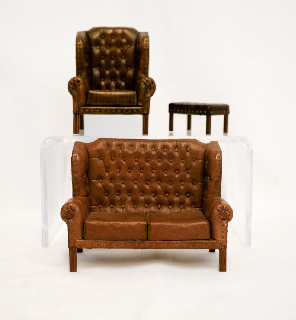 Peter Davies Dollhouse Miniature Furniture: Three pieces of miniature dollhouse furniture by Peter Davies. All three are signed, dated 1985 and 1986. Includes a leather wingback settle measuring 4.25" x 3.75", excellent condition. A wingback ar
