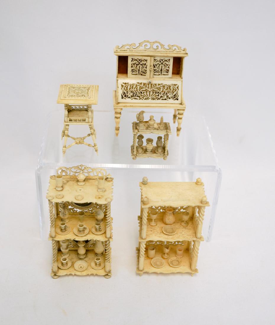 Group Finely Caved Bone Dollhouse Furniture: A group of finely carved bone dollhouse furniture measuring 1.5" to 3.75" in height. There are missing and or loose pieces, some of which are included and all five pieces must be considered as-is. We 
