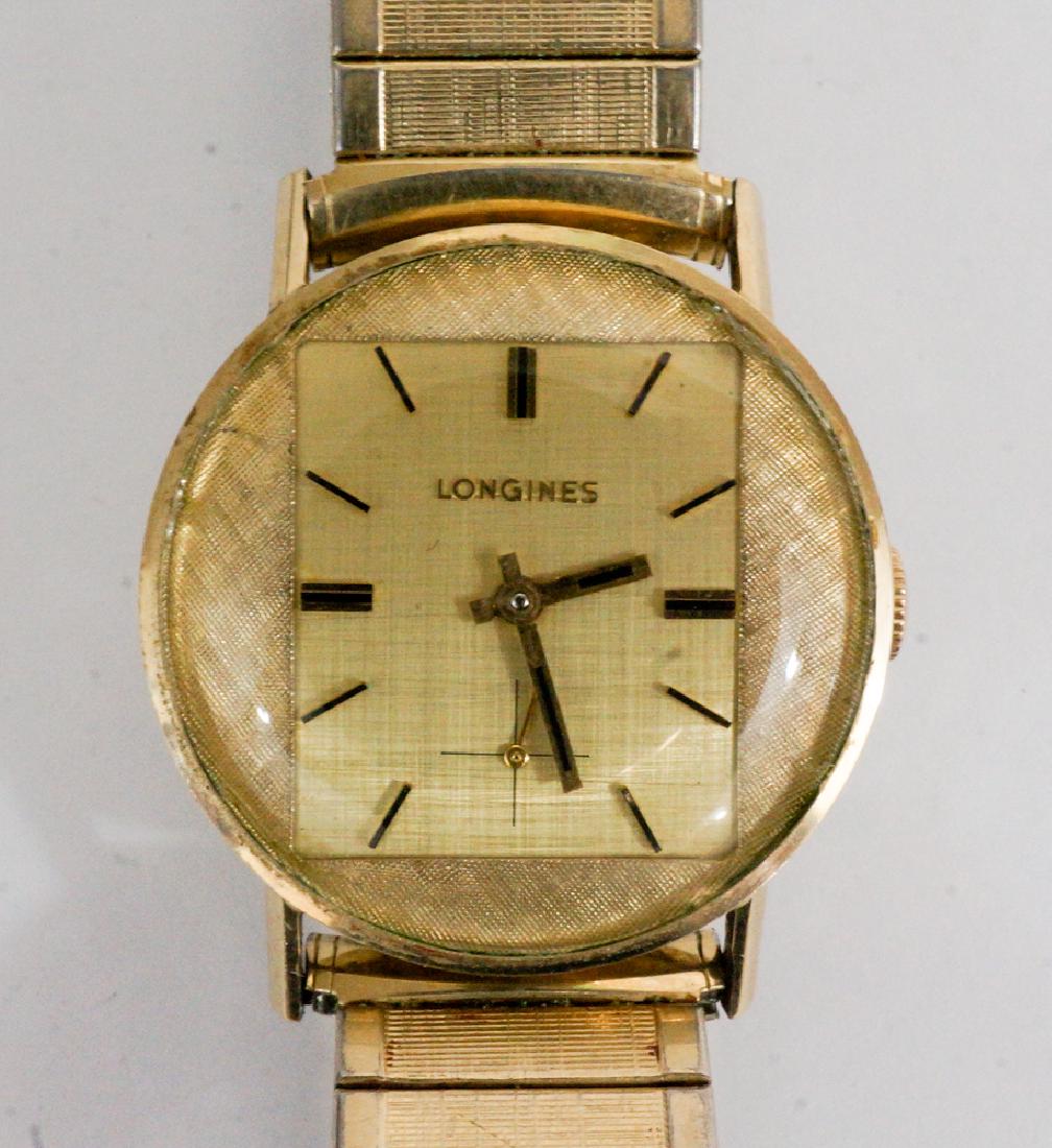 Longines Mid-Century Two-Tone Dial 10k Gold Filled: A Longines vintage two-tone dial 10k gold filled wrist watch. Measures 30 mm, not in running order. We ship most items in house. Exclusions include furniture, oversized framed artwork and heavier item