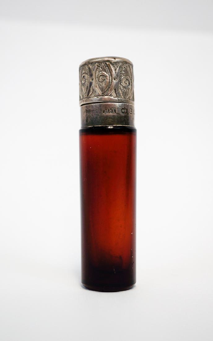 Date Mark 1899 Ruby Glass Scent Bottle Sterling: Date mark 1899 English sterling hallmarked ruby glass scent bottle with sterling mount and lid. Measures 3". We ship most items in house. Exclusions include furniture, oversized framed artwork and hea