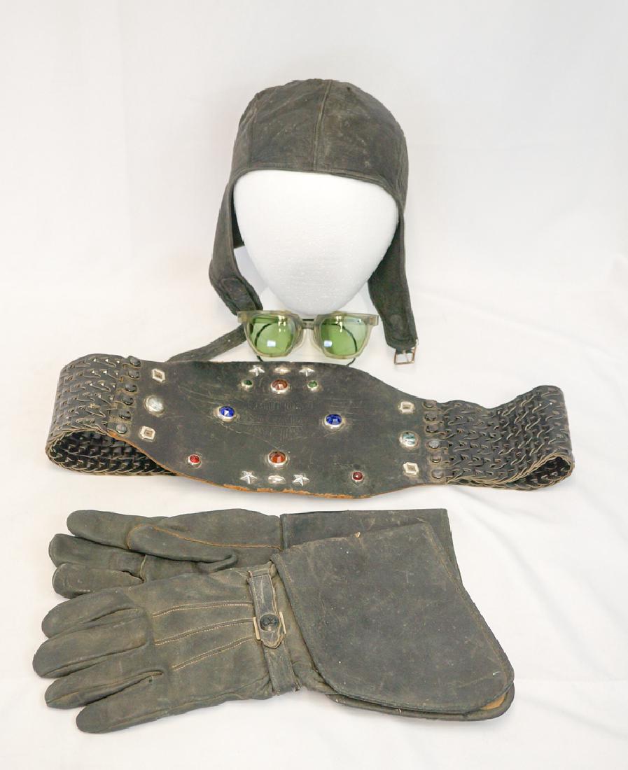 Vintage Motorcycle Accessories Lot: Vintage Harley Davidson jewel studded black leather kidney belt, pair of Harley Davidson black leather gauntlets, leather Beck skullcap, tinted goggles with folding mesh side pieces. Large to extra la