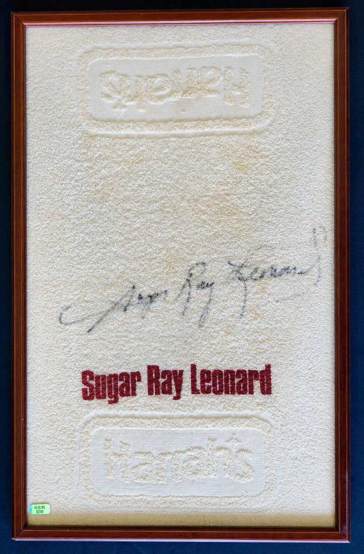 Sugar Ray Leonard Championship Fight Used Towel: Sugar Ray Leonard Towel Used in World Championship Fight. Measures 25.5" x 15.75" (sight size) and is professionally framed. Includes COA from Hollywood Sports Memorabilia, Little Rock, AR. Guaranteed