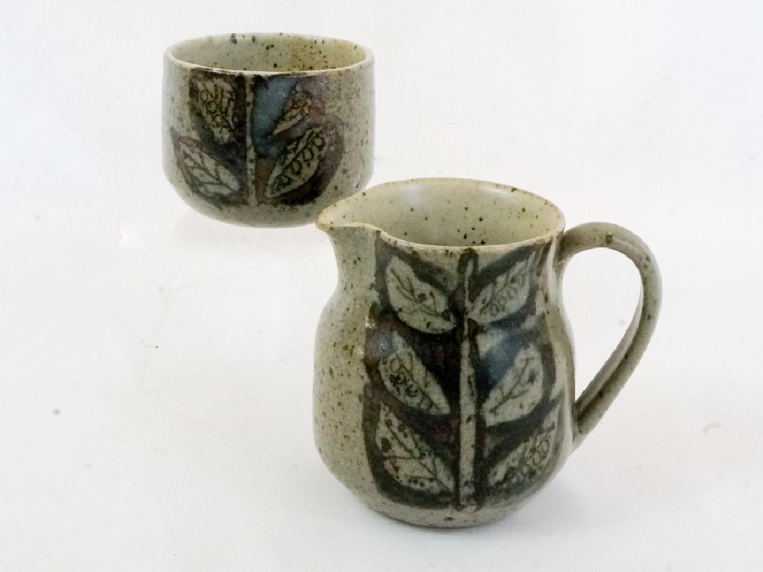 James and Nan McKinnell Sugar and Creamer: James and Nan McKinnell studio pottery sugar and creamer. Measure 2.25" and 3.75" tall. Both are in excellent condition with no cracks, chips or repairs. We ship most items in house. Exceptions includ