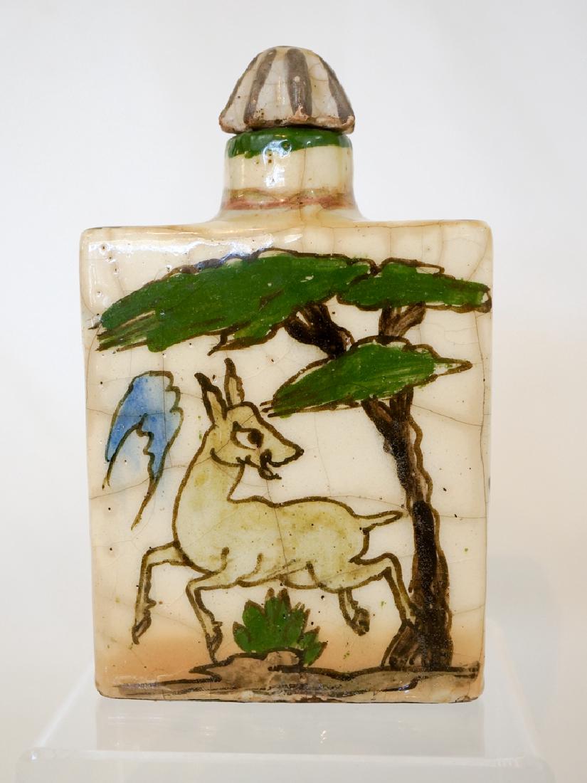 Qajar Persian Antique Pottery Bottle with Stopper: Qajar Persian antique pottery bottle with stopper. Measures 7" x 4.25" x 2". Has the usual crazing and small chips for a piece of this nature. We ship most items in house. Exceptions include most furn